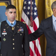Obama comforts Groberg after delivering the news. (Photo: Getty Images)